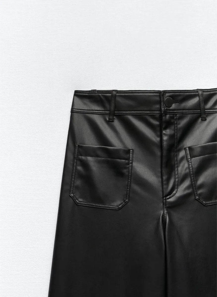 Black leather pants with a plain background