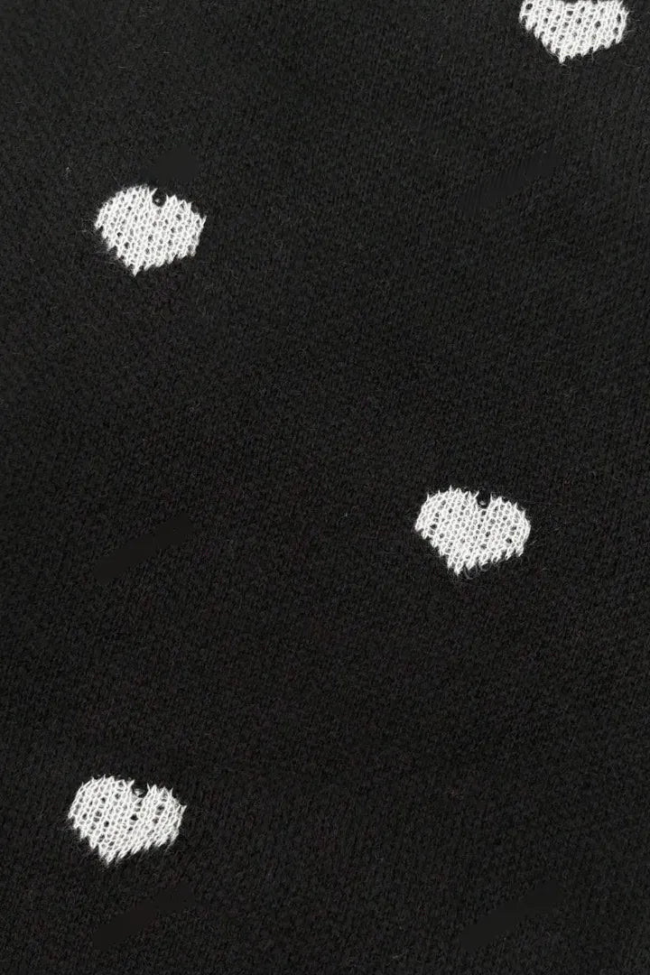 Black fabric with white heart patterns
