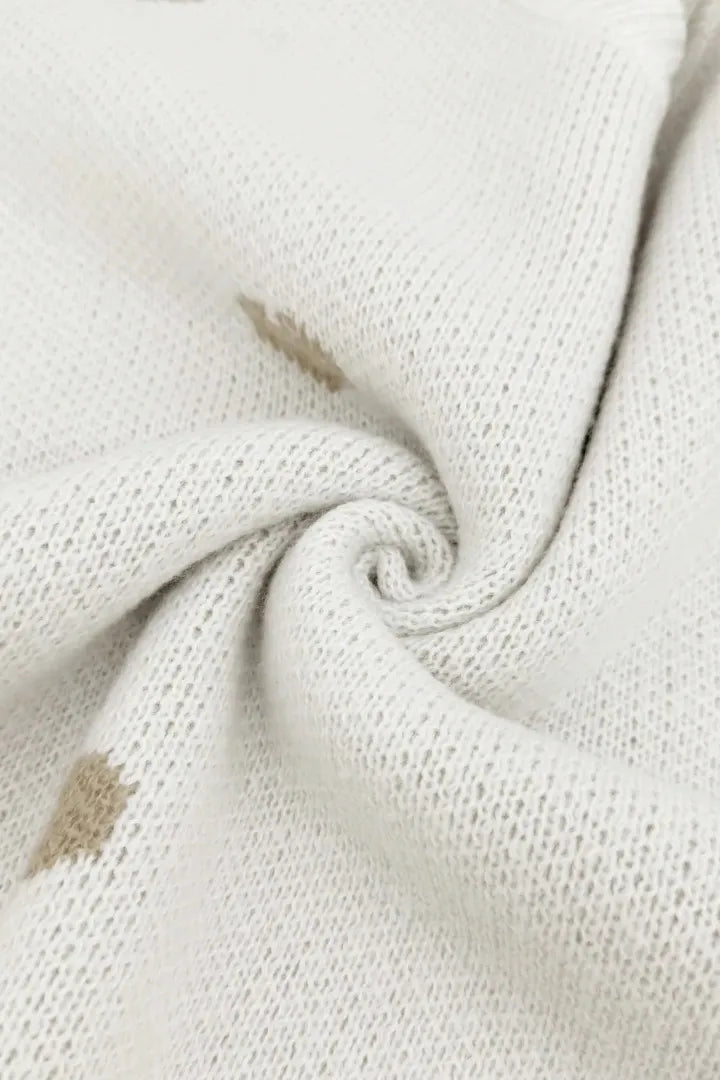 Close-up of textured beige fabric with a slight swirl.