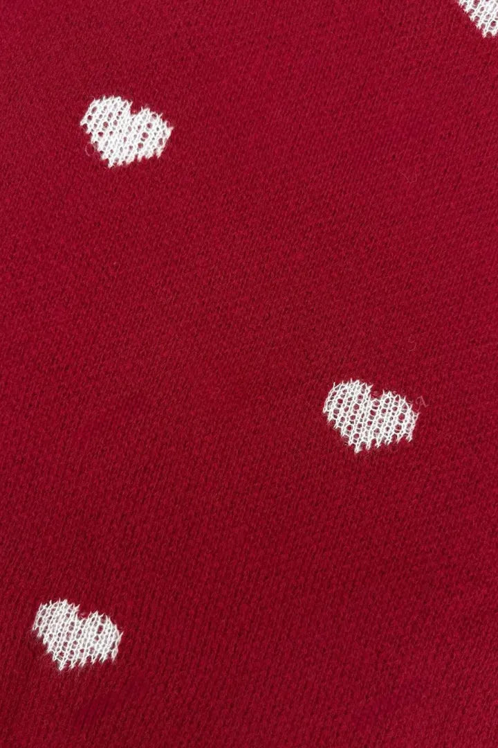 Red fabric with white heart patterns