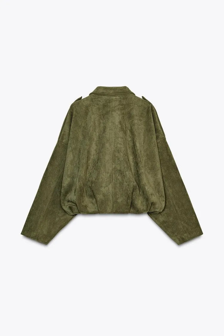 Green suede jacket on a light gray background