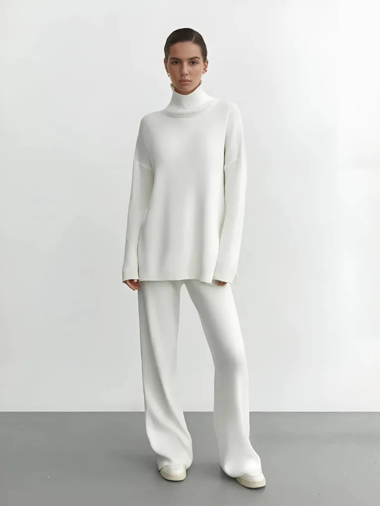 Person wearing a white outfit against a plain background