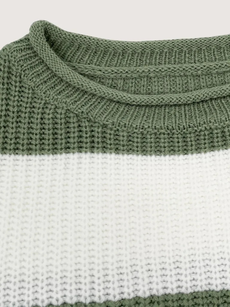 Close-up of a green and white striped sweater with a ribbed neckline.