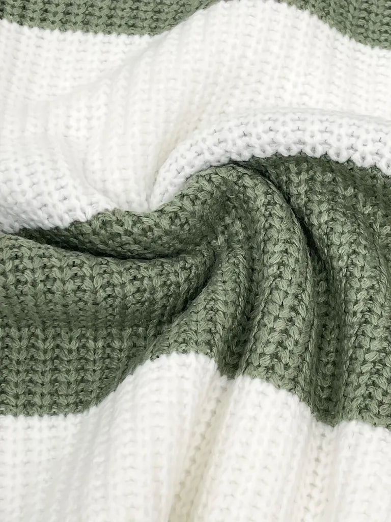 Close-up of a green and white striped fabric texture
