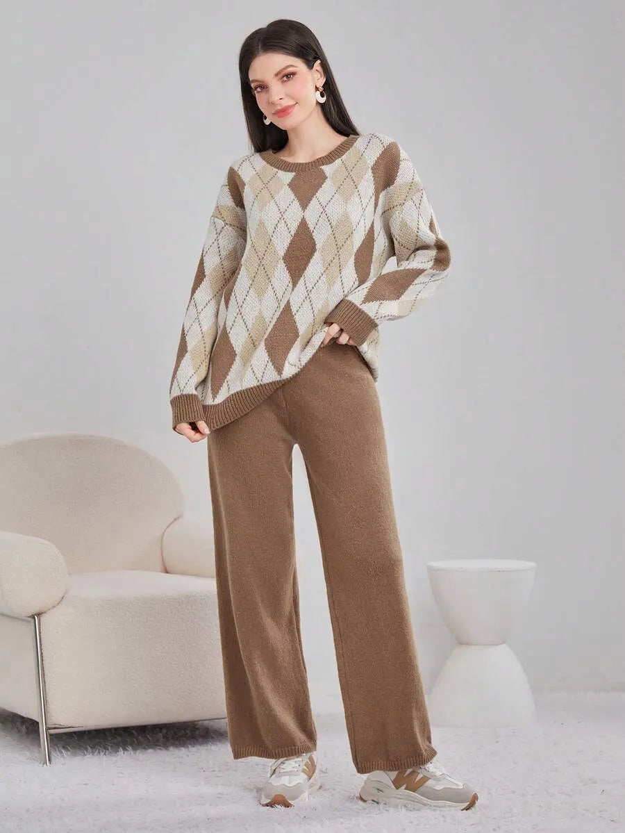 Woman wearing a brown and beige argyle sweater and pants in a minimalistic room.