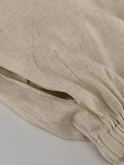 Beige fabric with a gold accent on a light gray background