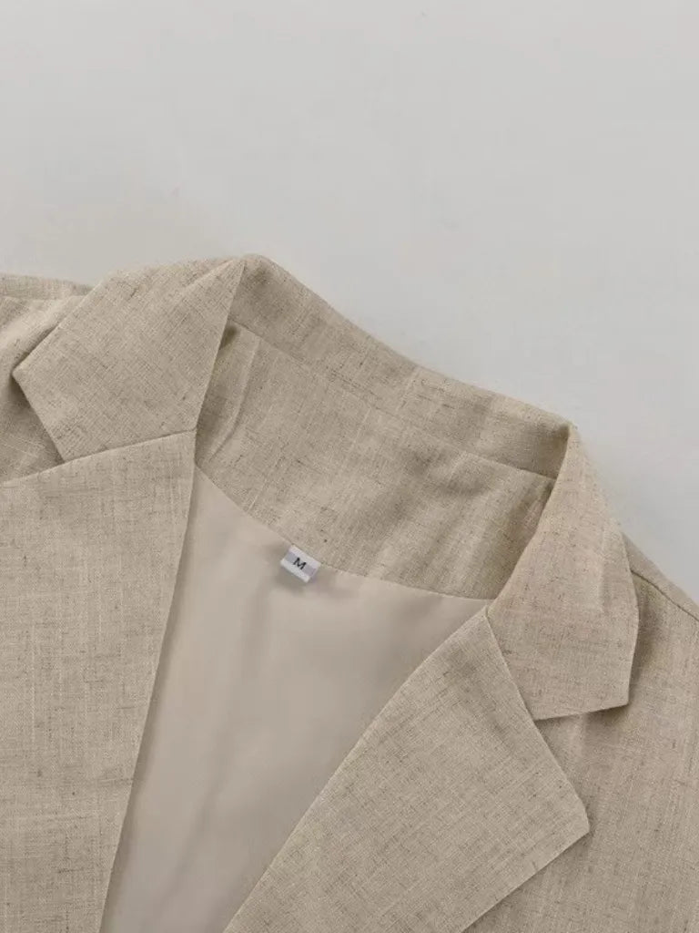 Beige linen jacket on a light gray background
