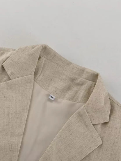Beige linen jacket on a light gray background