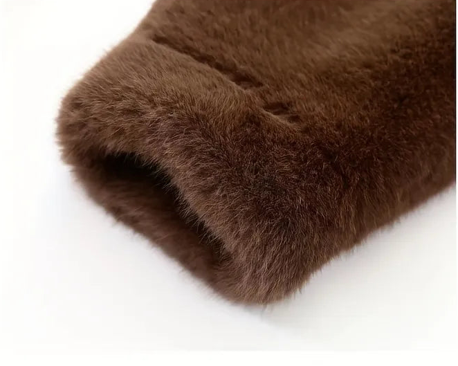 Close-up of brown fur texture on a white background