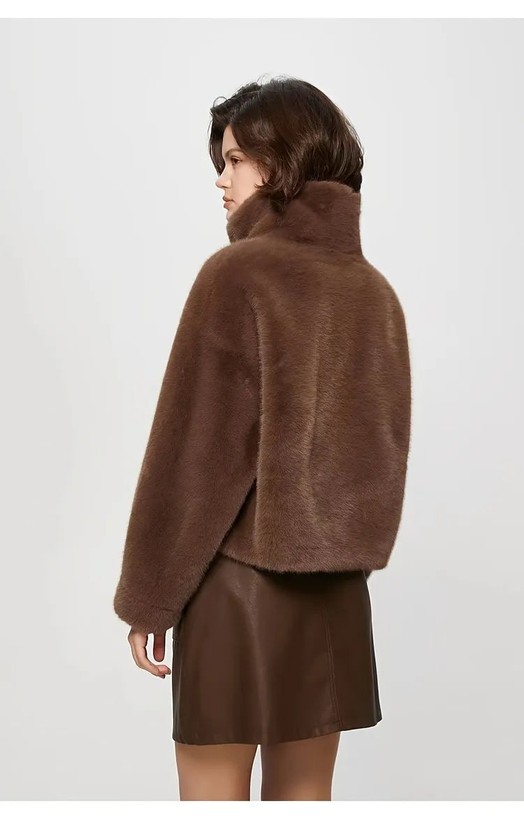 Person wearing a brown fur coat on a white background
