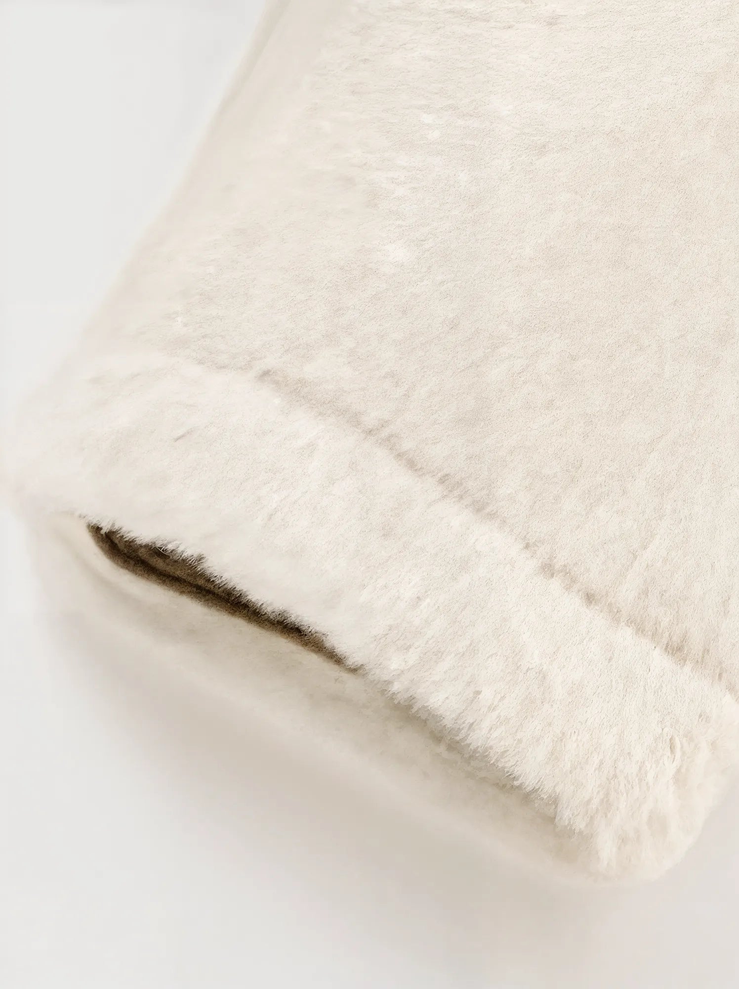 Close-up of a textured beige fabric on a light background