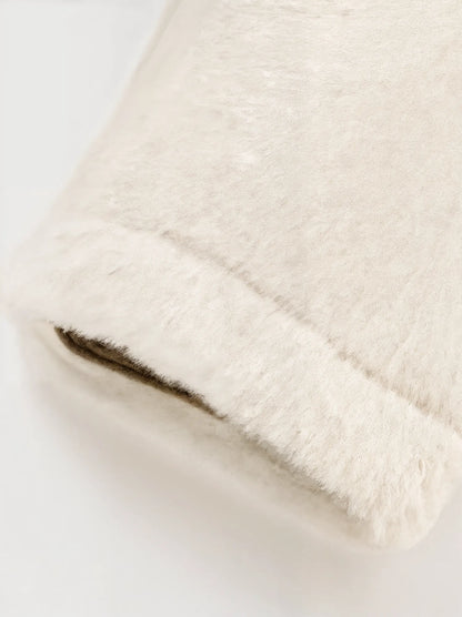 Close-up of a textured beige fabric on a light background