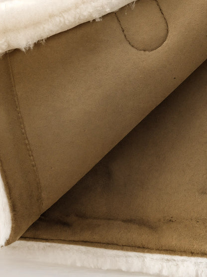 Close-up of brown fabric with white lining