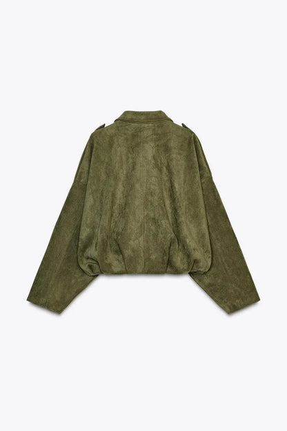 Green suede jacket on a light gray background