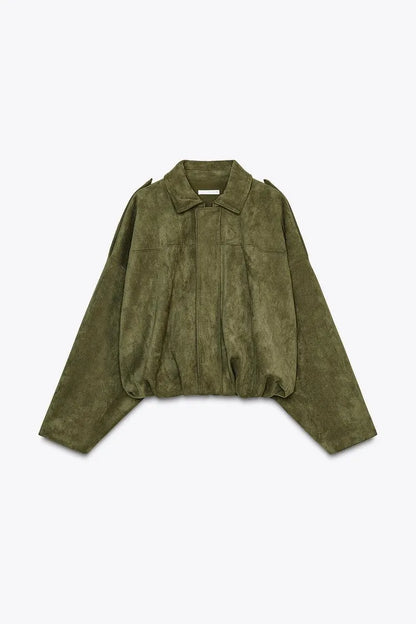 Green jacket on a light gray background