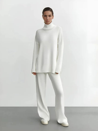 Person wearing a white outfit against a plain background