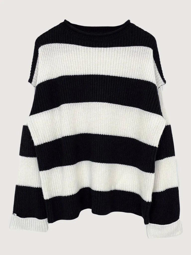 Black and white striped sweater on a light gray background