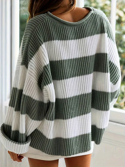 Green and white striped sweater worn by a person indoors.