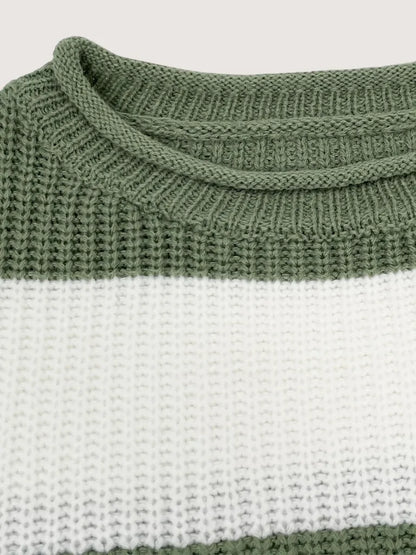 Close-up of a green and white striped sweater with a ribbed neckline.