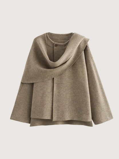 Brown cape on a light gray background