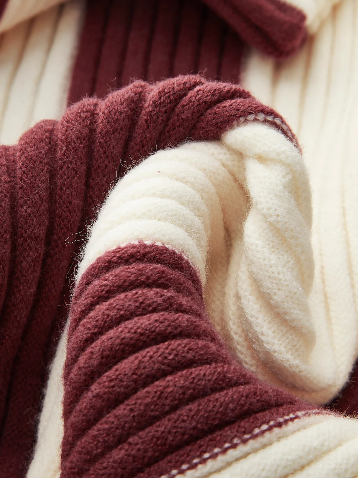 Close-up of red and white yarn skeins
