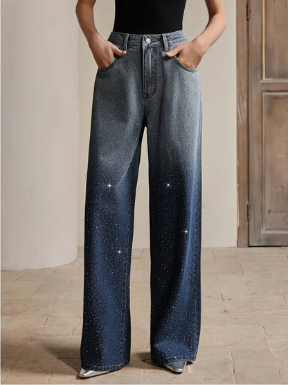 Person wearing wide-leg jeans in a neutral setting