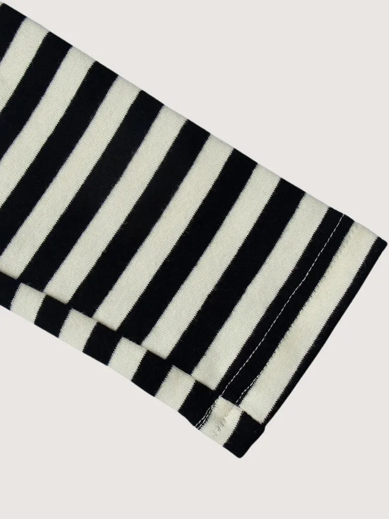 Black and white striped fabric on a light gray background