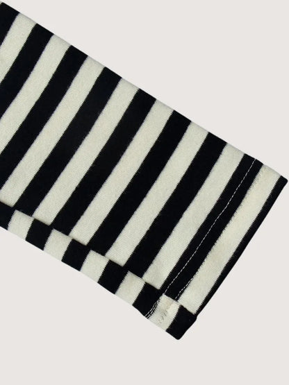 Black and white striped fabric on a light gray background