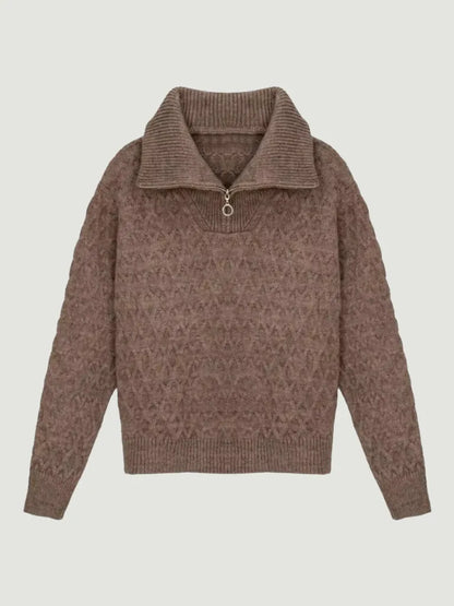 Brown patterned sweater on a light gray background